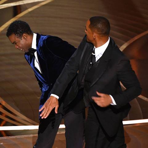 (FILES) In this file photo taken on March 27, 2022 US actor Will Smith (R) slaps US actor Chris Rock onstage during the 94th Oscars at the Dolby Theatre in Hollywood, California. - Possible sanctions against Will Smith for slapping Chris Rock at the Oscars last month will be discussed on April 8, 2022, 10 days earlier than previously scheduled, the body that oversees the awards said. (Photo by Robyn Beck / AFP)