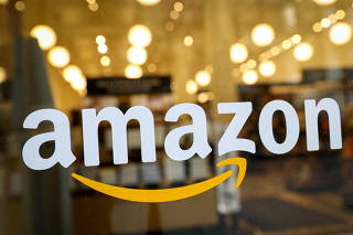 FILE PHOTO: FILE PHOTO: The logo of Amazon is seen on the door of an Amazon Books retail store in New York