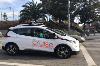 FILE PHOTO: A Cruise self-driving car, which is owned by General Motors Corp, is seen outside the company?s headquarters in San Francisco