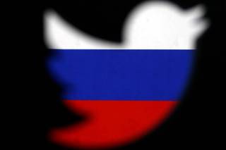 FILE PHOTO: A 3D-printed Twitter logo displayed in front of Russian flag is seen in this illustration picture