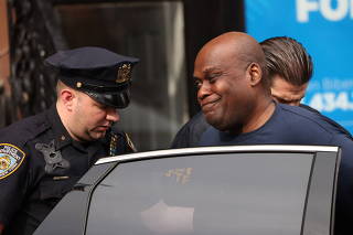 Frank James, the suspect in the Brooklyn subway shooting walks outside a police precinct in New York City