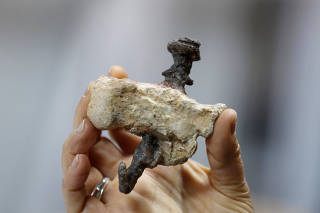 A replica of a find from Jerusalem, shows a heel bone pierced with an iron nail, believed to be the bone of Yehohanan Ben Hagkol, during a media tour presenting significant findings from that time, at Israel's National Treasures Storeroom, in Beit Shemesh,