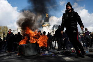 Protesters march in Paris to urge governments to call on the presidential candidates to take into account the climate emergency