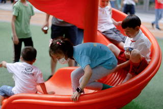 FILE PHOTO: Children at a playground inside a shopping complex in Shanghai