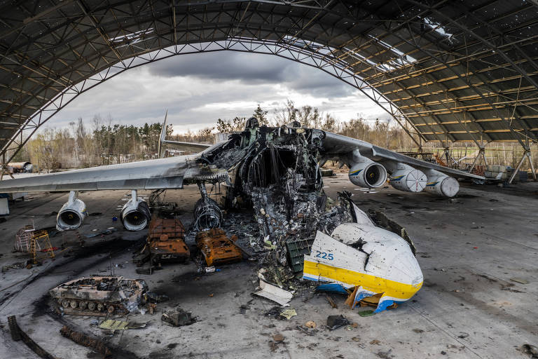The wreckage of Mriya, the world's largest cargo aircraft, at the Antonov airfield in Hostomel, near Kyiv, Ukraine, on Sunday, April 17, 2022. A cherished symbol of Ukraine, Mriya was destroyed in a pivotal battle at the start of the war. (Daniel Berehulak/The New York Times)