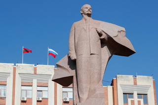 FILE PHOTO: A statue of communist leader Lenin is seen in front of the parliament building in Tiraspol