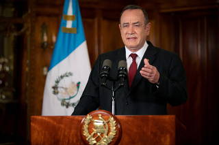 Guatemalan President Alejandro Giammattei delivers a televised message in Guatemala City