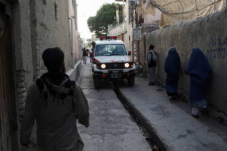 An Ambulance is seen near the site of explosions at Khalifa Sahib Mosque in Kabul