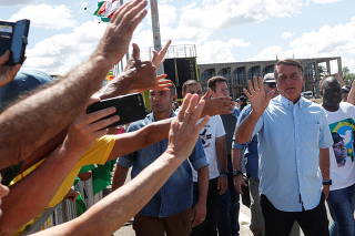 Brazilian President Jair Bolsonaro meets supporters during a demonstration 