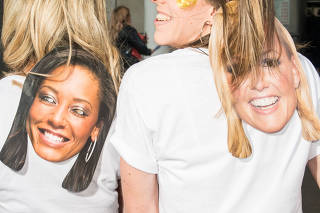 Fans identifying with Scary Spice (Melanie Brown) and Baby Spice (Emma Bunton) outside the Spice Girls reunion tour at Wembley Stadium in London, June 14, 2019. (Alexander Coggin/The New York Times)