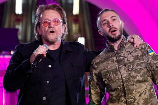Bono and Topolia sing during a performance for Ukrainian people inside a subway station in Kyiv