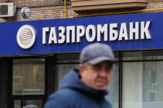 The logo of Gazprombank is seen at a branch office in Moscow