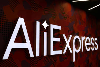 FILE PHOTO: The logo of AliExpress is seen inside the company's office in Moscow