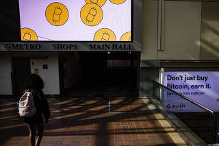 Bitcoins featured in ads Block Fi placed at Union Station in Washington, Aug. 24, 2021. (Samuel Corum/The New York Times)