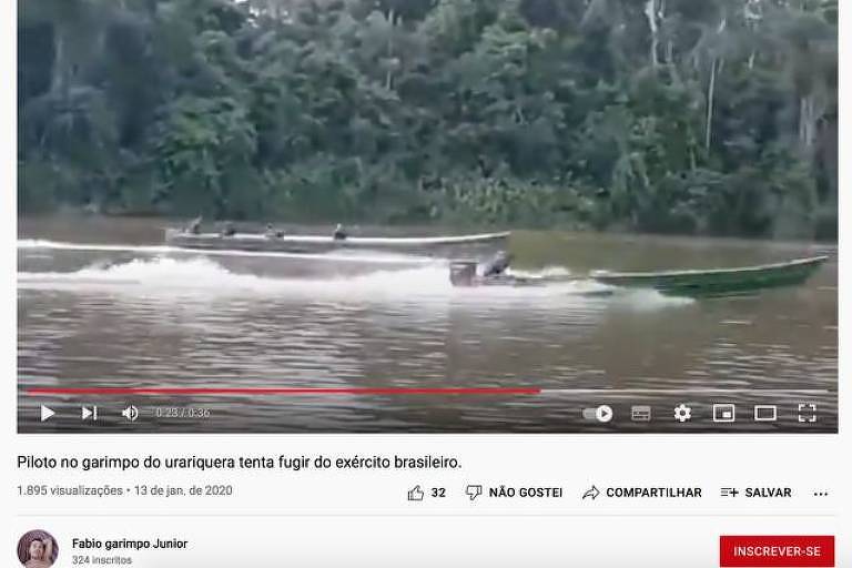 Imagem de reprodução de um vídeo mostra dois barcos em um rio