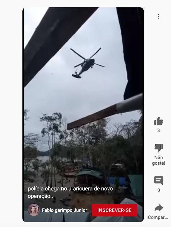 Imagem de reprodução de um vídeo mostra um helicóptero sobrevoando um território indígena 