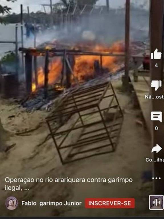 Imagem de reprodução de vídeo mostra incêndio em uma área próximo a um rio.