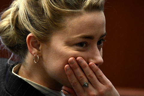 Actor Amber Heard looks on during a defamation case against her by ex-husband, actor Johnny Depp, at Fairfax County Circuit Courthouse in Fairfax, Virginia, U.S., May 17, 2022. Brendan Smialowski/Pool via REUTERS ORG XMIT: GDN