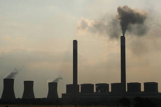 FILE PHOTO: Smoke rises from the Duvha coal-based power station owned by state power utility Eskom, in Mpumalanga province