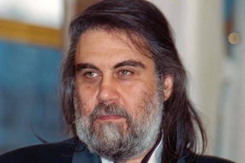 A picture taken on October 20, 1992 shows Greek musician and composer Vangelis Papathanassiou, known as Vangelis, posing at the French Culture Ministry after receiving a decoration. - Vangelis, the Greek composer of soundtracks for 