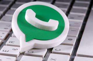 FILE PHOTO: A 3D-printed Whatsapp logo is placed on the keyboard in this illustration taken