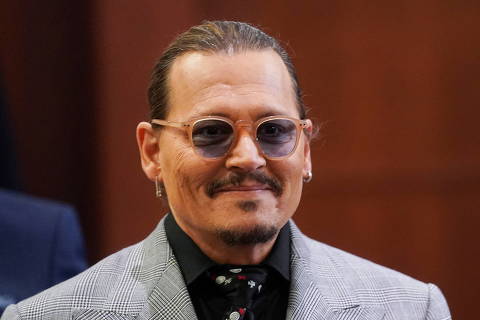 Actor Johnny Depp returns from a break during his defamation case against ex-wife, actor Amber Heard, at Fairfax County Circuit Court in Fairfax, Virginia, U.S., May 19, 2022. Shawn Thew/Pool via REUTERS ORG XMIT: GDN