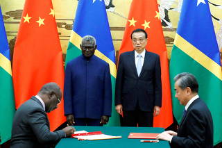FILE PHOTO: Solomon Islands Prime Minister Manasseh Sogavare, Solomon Islands Foreign Minister Jeremiah Manele, Chinese Premier Li Keqiang and Chinese State Councillor and Foreign Minister Wang Yi attend a signing ceremony at the Great Hall of the People i