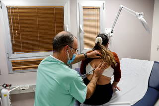 FILE PHOTO: A patient suffering from Long COVID is examined in the post-coronavirus disease (COVID-19) clinic of Ichilov Hospital in Tel Aviv