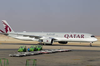 FILE PHOTO: Qatar Airways plane lands at the King Khalid International Airport, in Riyadh