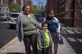 Luz Belliard, her granddaughter Victoria Alverez, 9, and a cousin of her daughter outside Public School 4 in New York, May 25, 2022. (Gregg Vigliotti/The New York Times)
