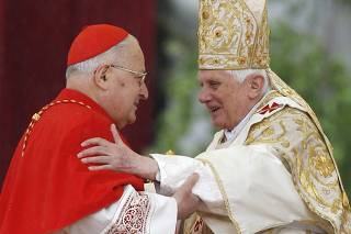 Pope Benedict XVI embraces Italian cardinal Angelo Sodano as he leads the Easter mass in Saint Peter's Square at the Vatican