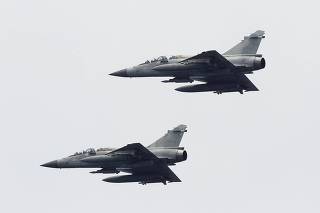 Taiwan Air Force Mirage-2000 fighter jets take part in a joint military drill outside a navy base in Kaohsiung port