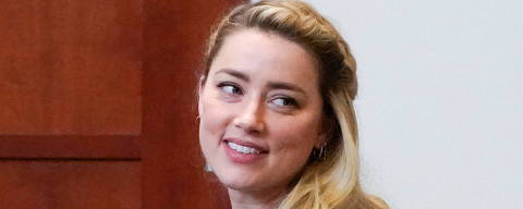 Actor Amber Heard leaves during a break in the courtroom during closing arguments during her ex-husband Johnny Depp's defamation case against her at the Fairfax County Circuit Courthouse in Fairfax, Virginia, U.S., May 27, 2022. Steve Helber/Pool via REUTERS? ORG XMIT: BLR