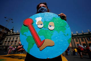 FILE PHOTO: Climate activists protest demanding action as G20 ministers meet in Naples