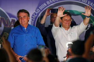 Brazil's President Jair Bolsonaro takes part of a farmer's fair of banana producers in Pariquera-Acu