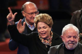 Brazil's former President Luiz Inacio Lula da Silva, Brazil's former President Dilma Rousseff and Sao Paulo's former Governor Geraldo Alckmin arrive at an event in Porto Alegre