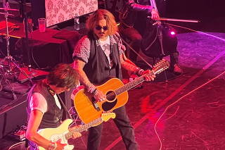 Actor Johnny Depp joins musician Jeff Beck on stage during concert, in Gateshead