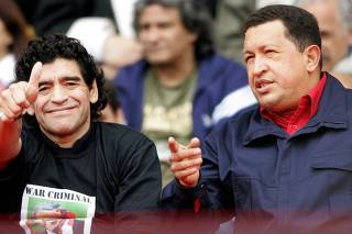 Hugo Chavez and Diego Maradona sit together at anti-Bush rally in Mar del Plata