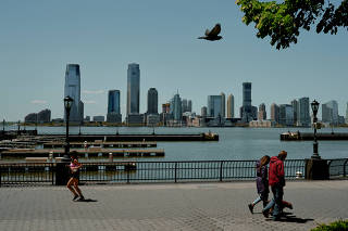 Esplanade at Battery Park City, in Manhattan, looking out to the Hudson River and Jersey City, N.J., on May 13, 2020. (Vincent Tullo/The New York Times)