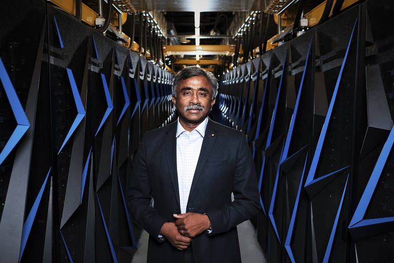 FILE Ñ Thomas Zacharia, director of the Oak Ridge National Laboratory, with an earlier supercomputer at the lab in Oak Ridge, Tenn., June 6, 2018. The United States has regained a coveted speed crown in computing with a powerful new supercomputer in Tennessee, a milestone for the technology that plays a major role in science, medicine and other fields. (Shawn Poynter/The New York Times)