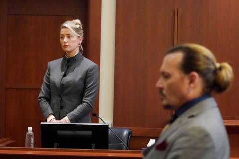 (FILES) In this file photo taken on May 16, 2022 US actors Amber Heard (L) and Johnny Depp watch as the jury leaves the courtroom at the end of the day at the Fairfax County Circuit Courthouse in Fairfax, Virginia. - A US jury found June 1, 2022 that actress Amber Heard had made defamatory claims of abuse against her ex-husband Johnny Depp, and awarded him $15 million in damages. (Photo by Steve Helber / POOL / AFP) ORG XMIT: VASH418