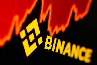 FILE PHOTO: Binance logo and stock graph are displayed in this illustration