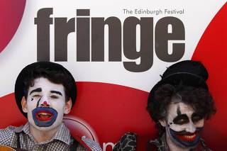 Performers from the Fourth Monkey Theatre Group sing in the Royal Mile during the Edinburgh Festival Fringe in Edinburgh, ScotlanActors from 'Oedipus The Hour' perform in the Royal Mile during the Edinburgh Festival Fringe in Edinburgh, Scotland
