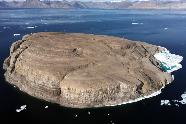 An image provided by Open Street Maps shows an aerial view of Hans Island, a small piece of land in the arctic that sits on the sea border between Canada and Greenland, an autonomous territory of Denmark. Canada and Denmark have agreed to divide the island, which for 49 years has been the source of a rare territorial dispute for Canada. (Open Street Maps via The New York Times)  -- NO SALES; FOR EDITORIAL USE ONLY WITH NYT STORY SLUGGED CANADA DENMARK ISLAND BY IAN AUSTEN FOR JUNE 14, 2022. ALL OTHER USE PROHIBITED. --