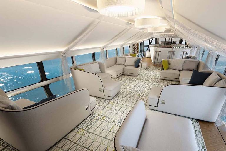 Sala dentro do dirigível, com vários sofás em tons de branco. Ao fundo, vidro transparente revelando mar e porçoões de neve.