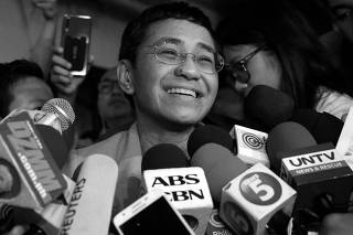 Maria Ressa, the CEO of online news platform Rappler, speaks to the media after posting bail at a Manila Regional Trial Court in Manila City