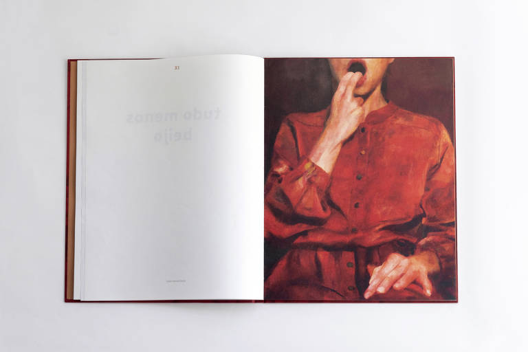 Fotografia de livro aberto com reprodução de pintura a direita e página em branco à esquerda