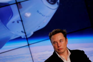 FILE PHOTO: SpaceX founder Elon Musk speaks at a post-launch press conference in Cape Canaveral