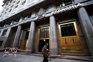 A person walks by the Ministry of Economy building in Buenos Aires? financial district