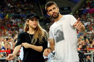 FILE PHOTO: Colombian singer Shakira and her partner, Barcelona soccer player Pique, attend the Basketball World Cup quarter-final game between the U.S. and Slovenia in Barcelona